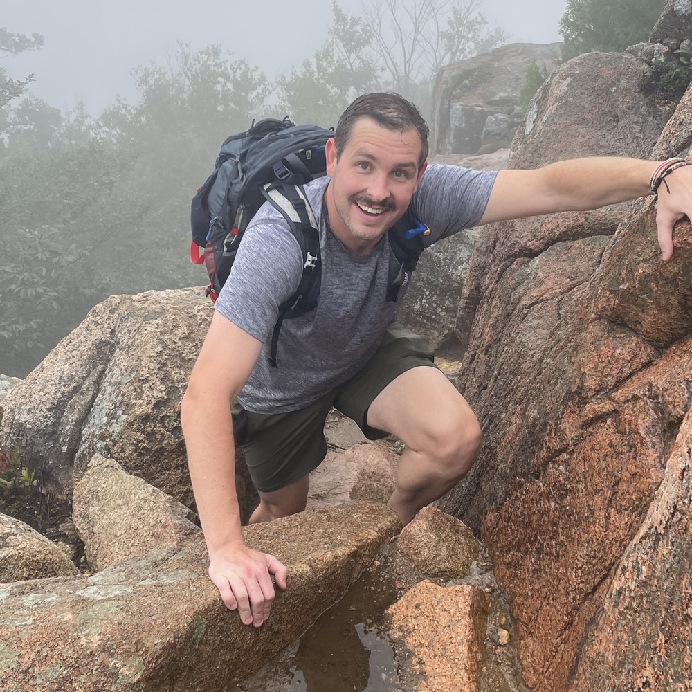 Austin Heltsley, local advertising representative with LM Media, smiling outdoors